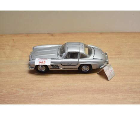 A 1987 Franklin Mint 1:24 scale Die-cast, 1954 Mercedes-Benz 300SL with tag and certificates, in card delivery box