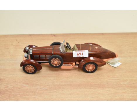 A Franklin Mint 1:24 scale Die-cast, 1924 Hispano-Suiza Tulipwood with tag and certificates, with polystyrene cradle