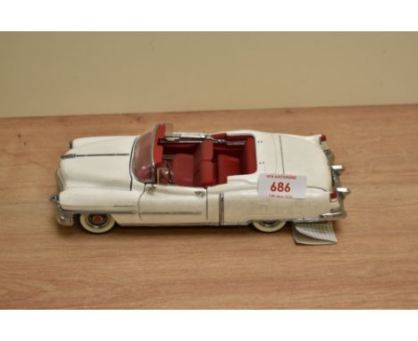 A 1991 Franklin Mint 1:24 scale Die-cast, 1953 Cadillac Eldorado with tag and certificates, in card box with polystyrene crad