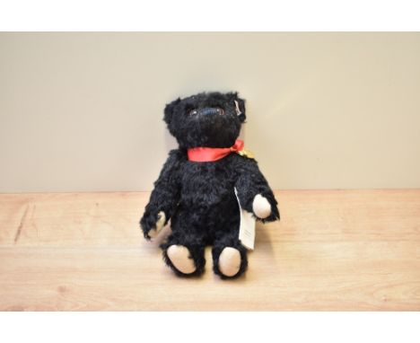 A modern Steiff Limited Edition Teddy Bear, 663888 Titanic Centenary Bear, No 1216 with button, tag, tote bag, Titanic Model,