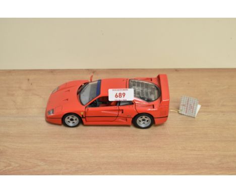 A 1991 Franklin Mint 1:24 scale Die-cast, 1989 Ferrari F40 with tag and certificates, in card box with polystyrene cradle