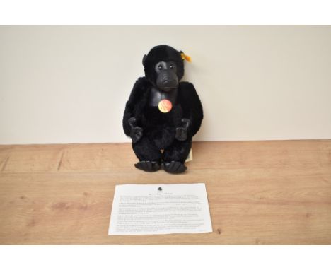 A modern Steiff Bear, 660634 Gorilla with yellow tag and button, in pull string bag