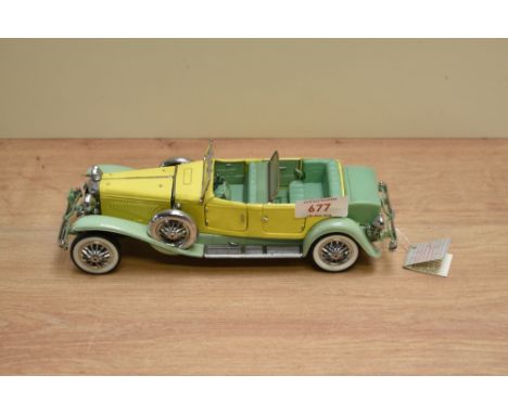 A 1987 Franklin Mint 1:24 scale Die-cast, 1930 Duesenberg J Derham Tourster with tag and certificates, in card box with polys