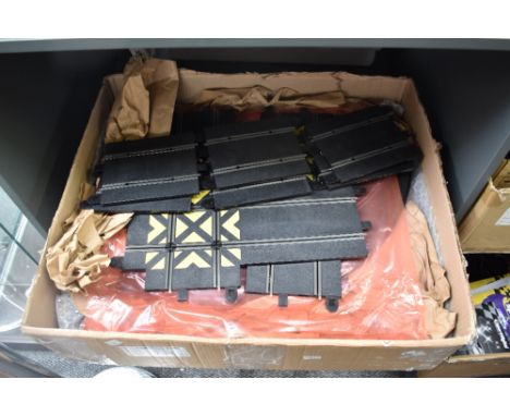 Six shelves of modern Scalextric Track, Card Grandstands, Accessories, Cars, Re-Fueling Crews, Instructions etc