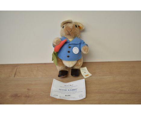 A modern Steiff Bear, 660481 Peter Rabbit with yellow tag and button, in pull string bag