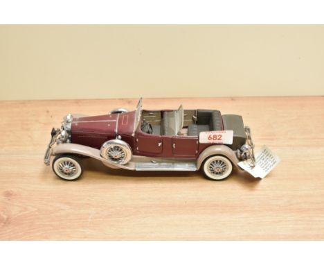 A 1987 Franklin Mint 1:24 scale Die-cast, 1930 Duesenberg J Derham Tourster with tag and certificates, in card box with polys