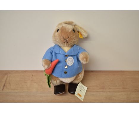 A modern Steiff Bear, 660481 Peter Rabbit with yellow tag and button, in pull string bag