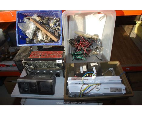Emergency light parts, speaker, plumbing fittings and radio for repair.