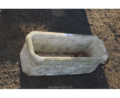 A concrete rectangular garden planter, 28" x 11" x 10" high.