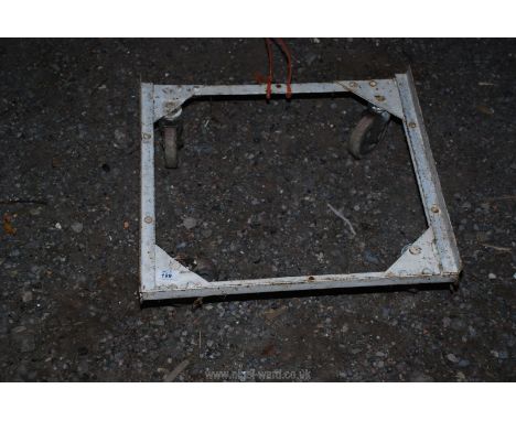 A light metal four wheel trolley.