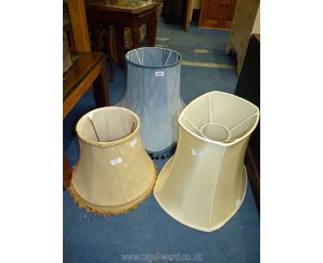 Three large lamp shades, including. one blue tasseled.