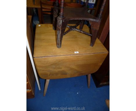 An Ercol drop leaf dining table, 29'' wide x 25" extend with two leaves to 53 1/2'' long  x 28 1/2'' high 