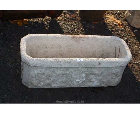 A concrete rectangular garden planter, 28" x 11" x 10" high.