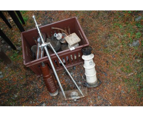 Box of lamp bases, marble and electric insulators.
