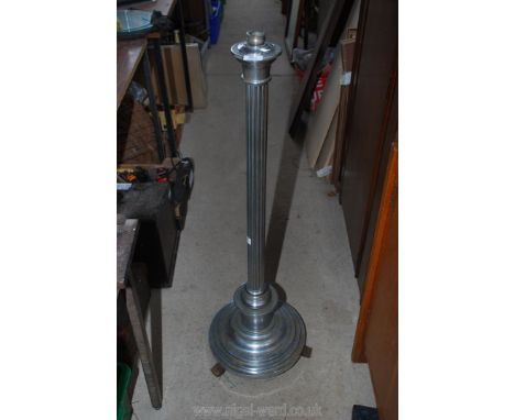 A chrome lamp stand.