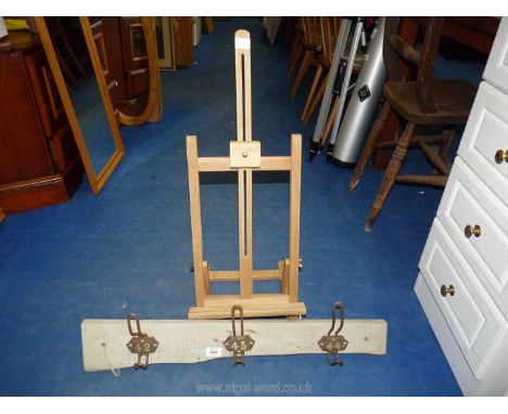 A vintage coat rack and table top easel.