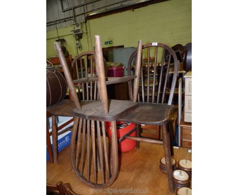 Three stick back kitchen chairs.