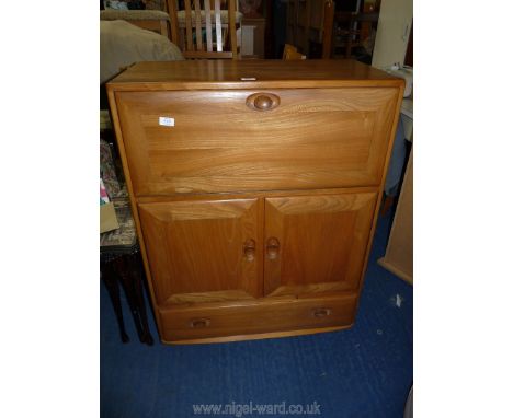 An Ercol cocktail cabinet, 32 1/4'' wide x 43'' high x 17'' deep