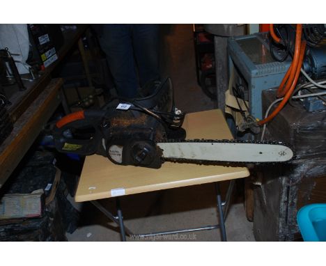 Electric chainsaw with chain guard.