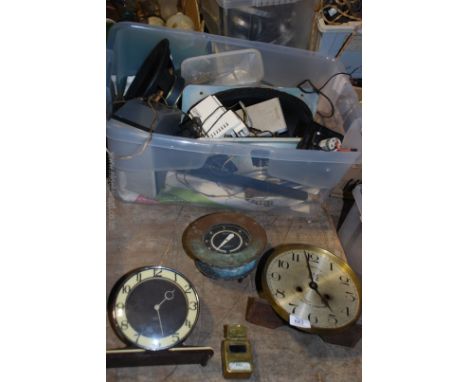 A box of clocks, speakers and a brass BBC foot candle light meter.