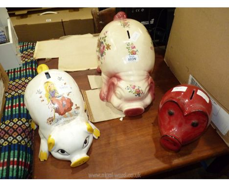 Three ceramic piggy banks.