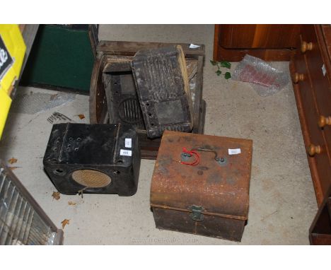 A small tin trunk with key, Bakelite cases, etc.