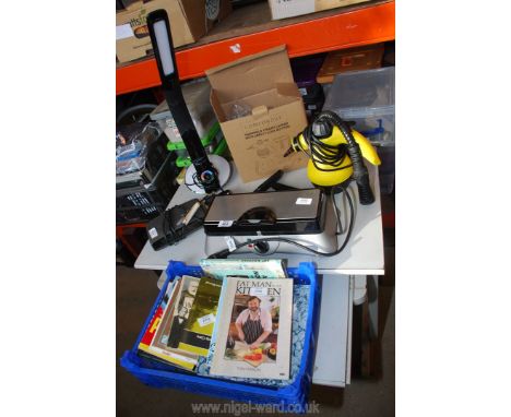 A LED desk light, hand steamer, waffle maker and assorted books, etc.