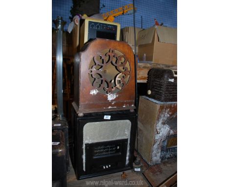 A radio wooden framed speaker and aerial.