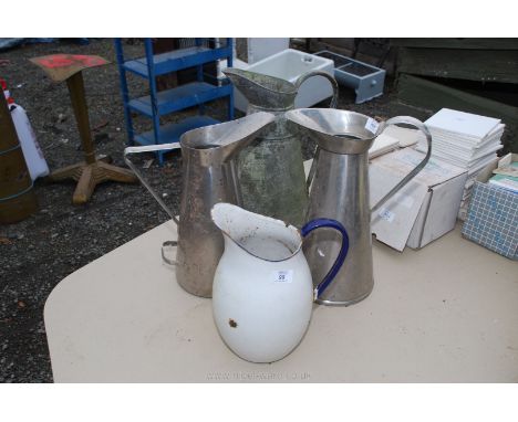4 jugs; 1 enamel, 1 galvanised, 2 stainless steel.
