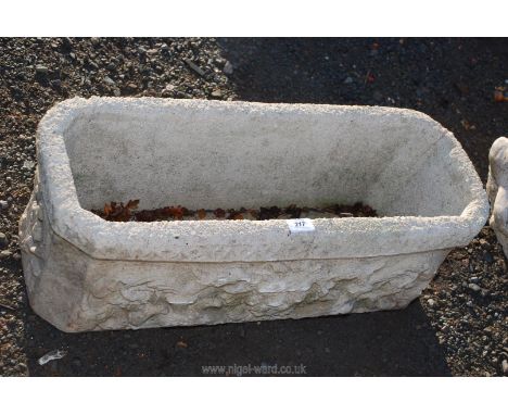 A concrete rectangular garden planter 28" x 11" x 10" high.