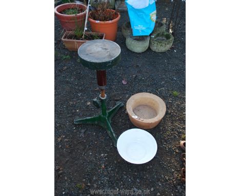 A metal adjustable turn table, enamel bowl and kiln bowl.