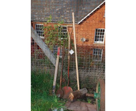 A turf spade, splitting axe, broom etc.