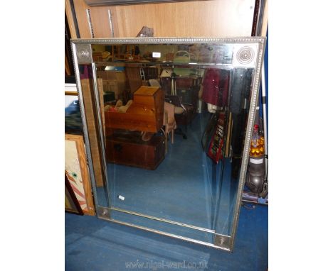 A large over mantel mirror, 39" x 49" high.