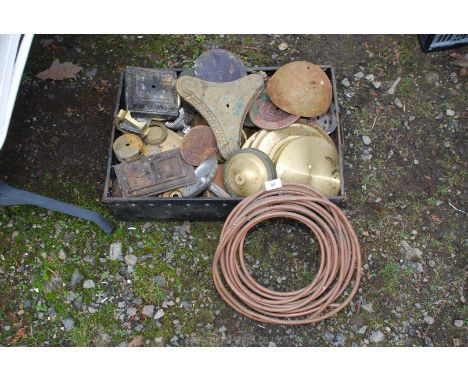 A box of miscellaneous copper and brass lamp parts and copper pipe.