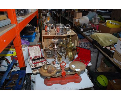 A set of weighing scales, cutlery set, brass ware, etc.