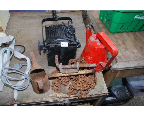 A spot light, oil cans, chain etc.