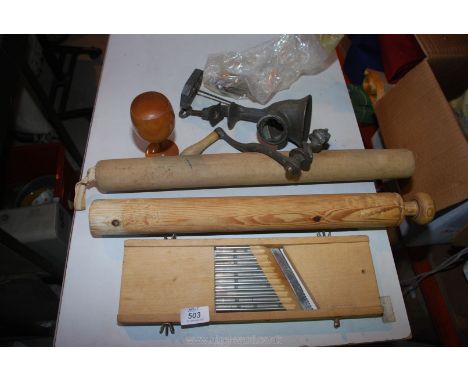 A rolling pin, wooden slicing machine, goblet and mincer.