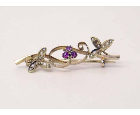 Yellow metal  brooch with indistinct hall mark, floral spray, decorated with spit pearls and ruby, contained in a presentatio