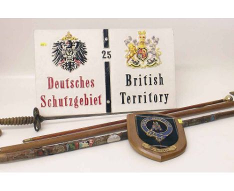 Reproduction British/German territory sign, also a swagger stick, rapier, axe, walking stick and a wall plaque. Condition rep