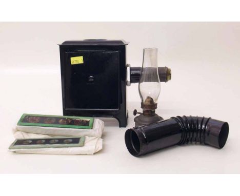 German tin plate magic lantern with burner and slides. Condition report: see terms and conditions