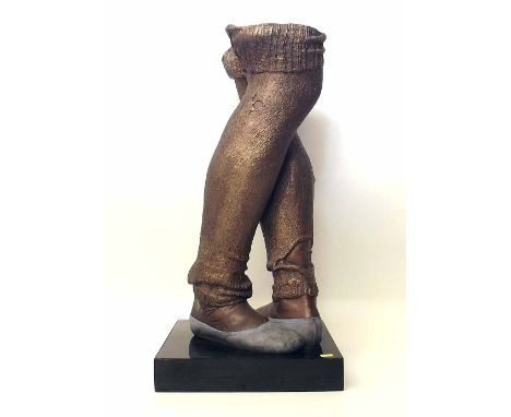 Ceramic sculpture modelled in the form of a pair of dancers legs with knitted woollen leg warmers, pewter coloured glaze with