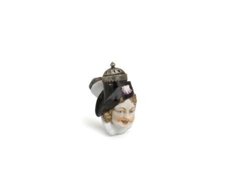 A Nymphenburg pipe bowl in the shape of a Harlequin's head, circa 1757Modelled by F.A. Bustelli, Harlequin wearing a pilgrim'