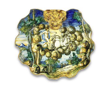 An Italian maiolica istoriato shell-moulded basin, 19th CenturyMoulded with a mask handle and three shell feet, the top paint