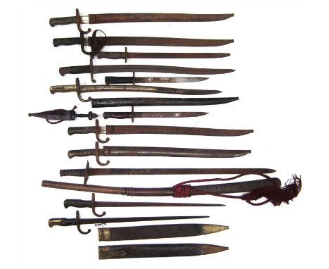 Collection of fourteen swords and bayonets, including five Chassepot M1866 bayonets, two M.1874 Gras bayonets, an Enfield / S