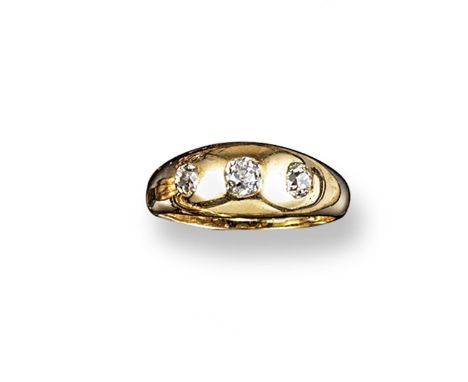 A diamond three stone gold 'gypsy' ring, set with graduated old cushion-cut diamonds in yellow gold. Size T.