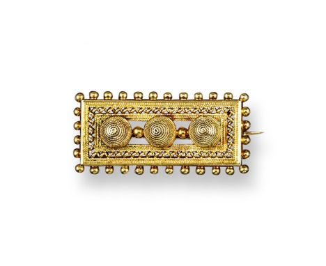 A late Victorian filigree gold ring, set with garnets and seed pearls. Size O 1/2. An Etruscan style gold rectangular brooch,