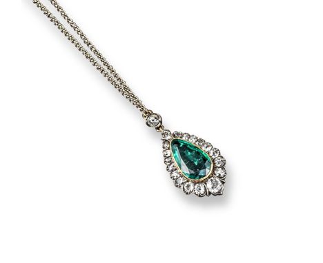 An emerald and diamond-set pendant, the pear-shaped emerald is set within a surround of graduated cushion-shaped diamonds in 