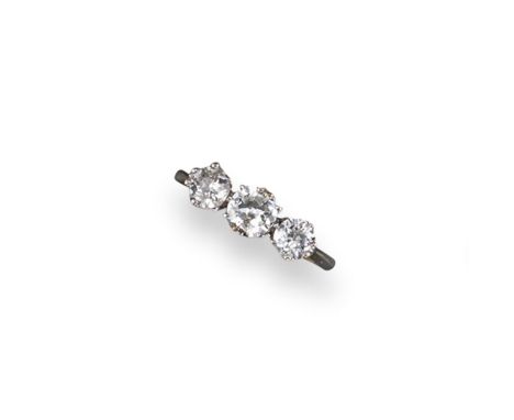 A diamond three stone ring, the three circular cut diamonds are set in platinum and gold. Size K 1/2.