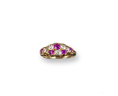 A ruby and diamond chequerboard ring, set with old cushion-cut rubies and diamonds in gold. Size M.