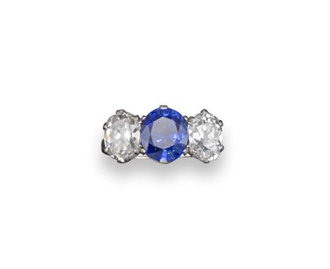 A three stone sapphire and diamond ring, the oval-shaped sapphire weighs approximately 3.60cts, set with old oval-shaped diam